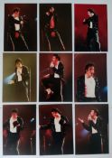 A collection of professional photographs taken of Michael Jackson on stage in 1992 performing his