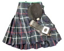 A box containing a kilt, a leather belt and a cloth cap bearing Royal British Legion badge.