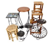 A nest of three graduated bamboo and wicker tables together with a metal plant stand in the form of