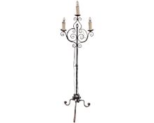 A wrought iron three way standard lamp