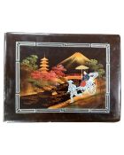 A 20th century Chinese lacquered photo album containing monochrome photographs including scenes of