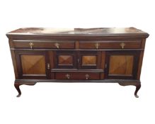An Edwardian mahogany sideboard