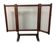 A 19th century mahogany three way glass panelled fire screen
