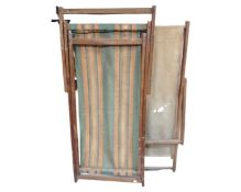 Two vintage folding deck chairs together with a large quantity of assorted garden tools