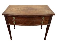 A mahogany Regency style two drawer cutlery table on raised legs