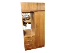 A 20th century teak combination wardrobe