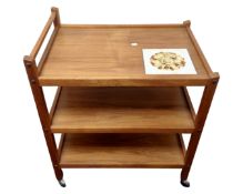 A 20th century Danish teak three tier serving trolley with inset tiled panel (af)