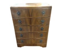 A 20th century walnut bow fronted five drawer chest