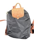 A Longchamp Le Pilage black back pack.