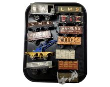 A tray containing vintage Hornby tin plate rolling stock.