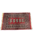 A Tekke design rug, 78cm by 130cm.