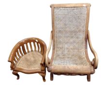 An Eastern mahogany and bergere child's low armchair (Af) together with a further child's tub chair