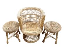 A wicker tub armchair together with a pair of wicker stools and carved occasional table
