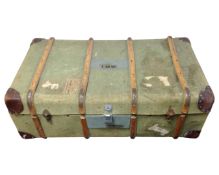 A bentwood canvas travelling trunk