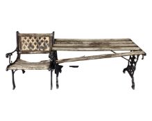 A cast iron wooden slatted garden table and matching armchair.