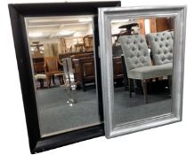 A silvered framed bevelled mirror together with a further mirror