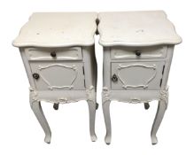 A pair of French style bedside cabinets fitted a drawer on raised legs