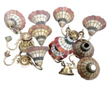 A box containing brass two way light fittings with leaded glass shades.