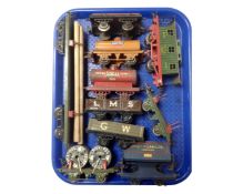 A tray containing vintage Hornby tin plate rolling stock.