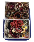 Two boxes containing a quantity of assorted costume jewellery.