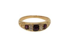 A gold diamond and ruby ring, size N CONDITION REPORT: Marks rubbed. 4g.