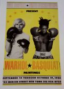 A poster for Warhol/Basquiat paintings.
