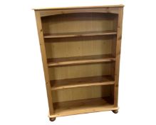 A set of contemporary pine open bookshelves