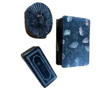 Three antique ebonised snuff boxes.