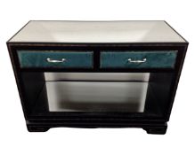 A contemporary two tier mirror topped console table fitted with two drawers