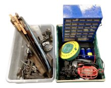 Two crates containing handsaws, hand tools, an extension lead, multi drawer chest etc.