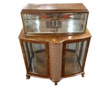 A walnut Art Deco cocktail display unit on claw and ball feet