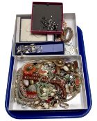 Two boxes containing a large quantity of assorted costume jewellery.