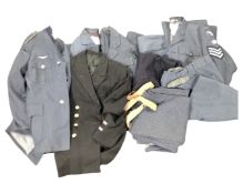 A box containing British and German two piece dress uniforms together with Naval uniform