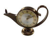 A Swiza seven jewel lamp alarm clock.