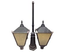 A Victorian style garden light in the form of a street light with extra lantern top