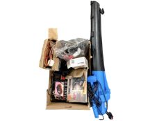 A garden vacuum together with a box containing power tools, a charging station,