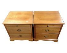 A pair of Stag two drawer bedside chests with slide in teak finish