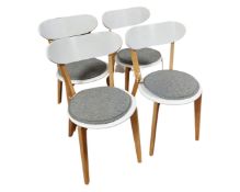 A set of four oak effect painted chairs.