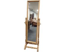 A pine cheval mirror.