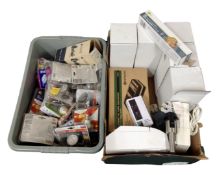 Two boxes containing light bulbs, food bags, a laser distance meter,