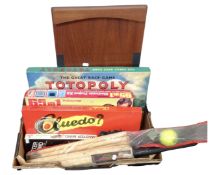 A box containing vintage board games, a 65 in 1 electric project science kit, a cricket set etc.