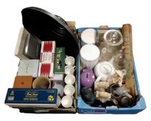 Two boxes containing storage jars, glassware, figurines, marble book ends, metal lightshade, mugs,