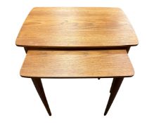 A nest of two teak tables.