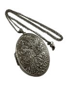 A Sterling silver oval locket on silver chain
