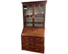 A George III mahogany bureau bookcase.
