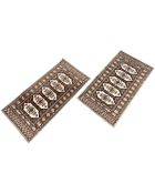 A pair of machined Lahore Bokhara rugs, Pakistan, 61cm by 120cm.