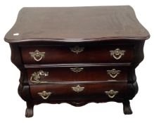 A continental bombé cabinet on claw and ball feet, fitted with a drawer beneath.