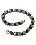 A 9ct gold opal and ruby bracelet, length 19cm.
