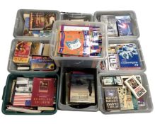 A pallet containing nine crates of hard and soft cover books including photography, reference,