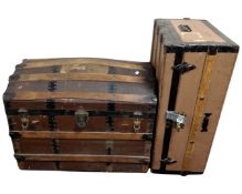 An early 20th century bentwood bound dome topped shipping truck together with a further shipping
